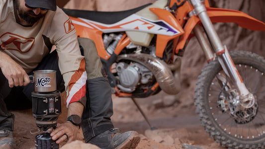 Luke making coffee next to a KTM motorcycle